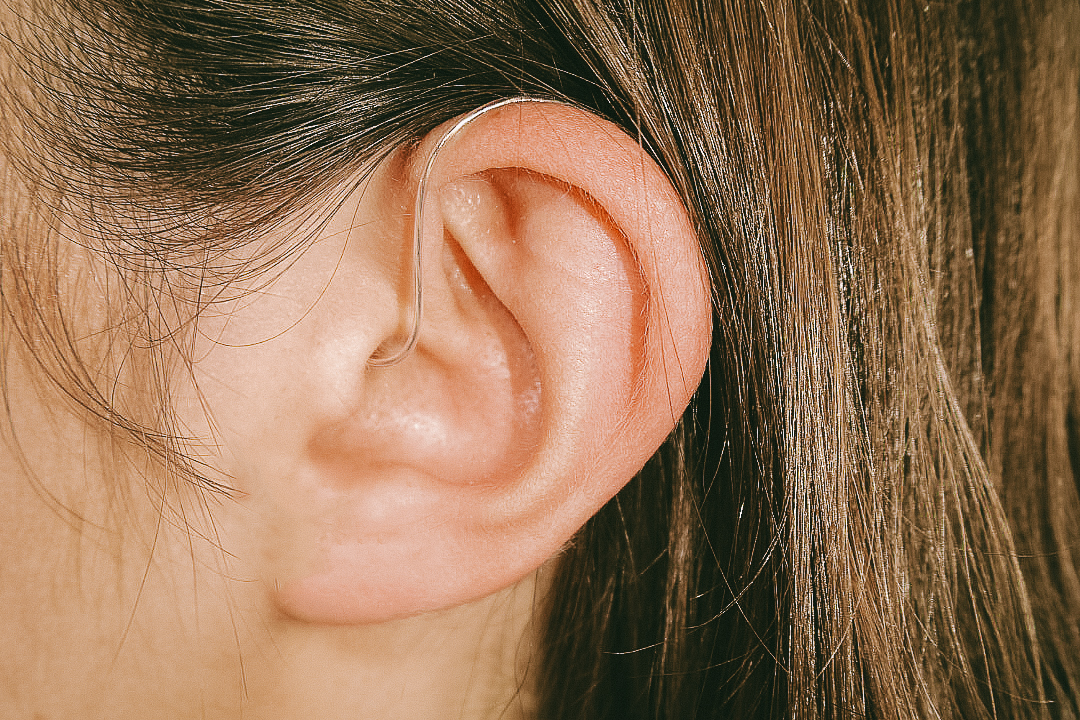 Hearing aid in a person’s ear